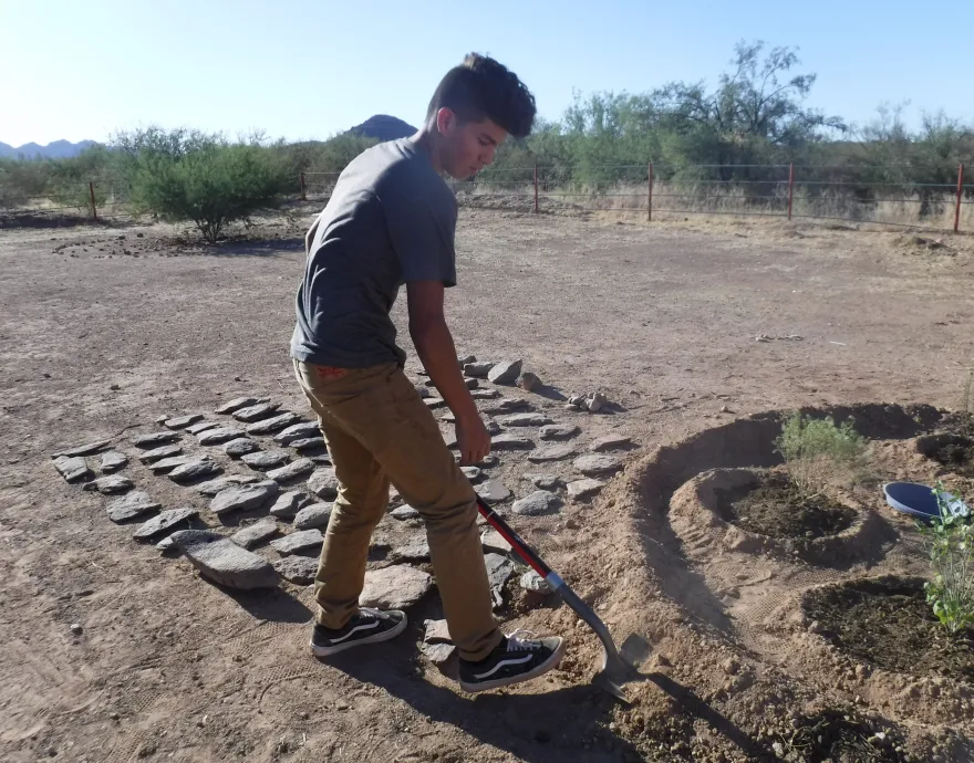 Young man working in the garden in Arizona
