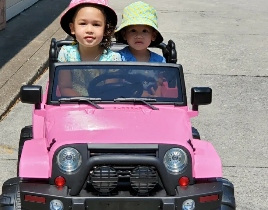 Girls in small pink truck