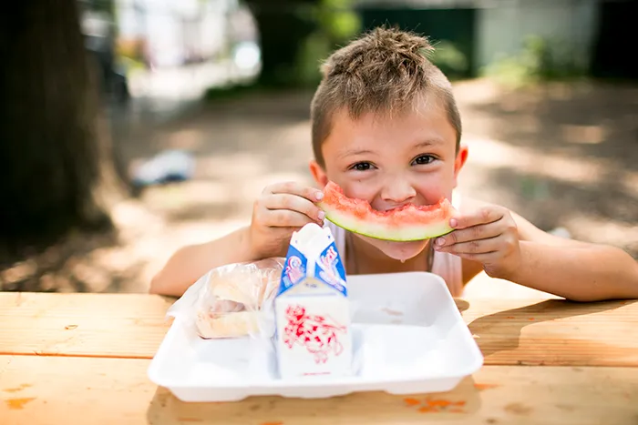 kid eating watermelon