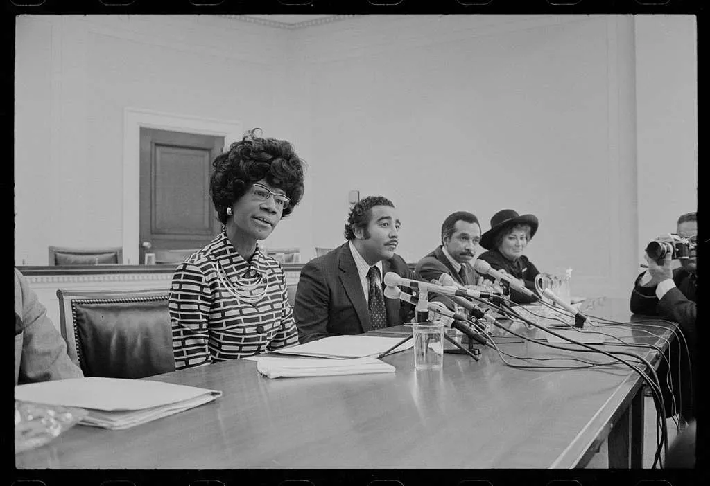 Black woman sitting at a table. Black and white picture