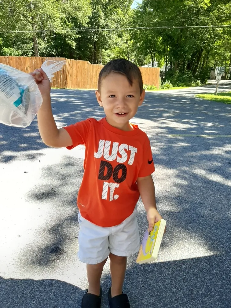 Kid holding bags