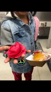 girl giving a flower