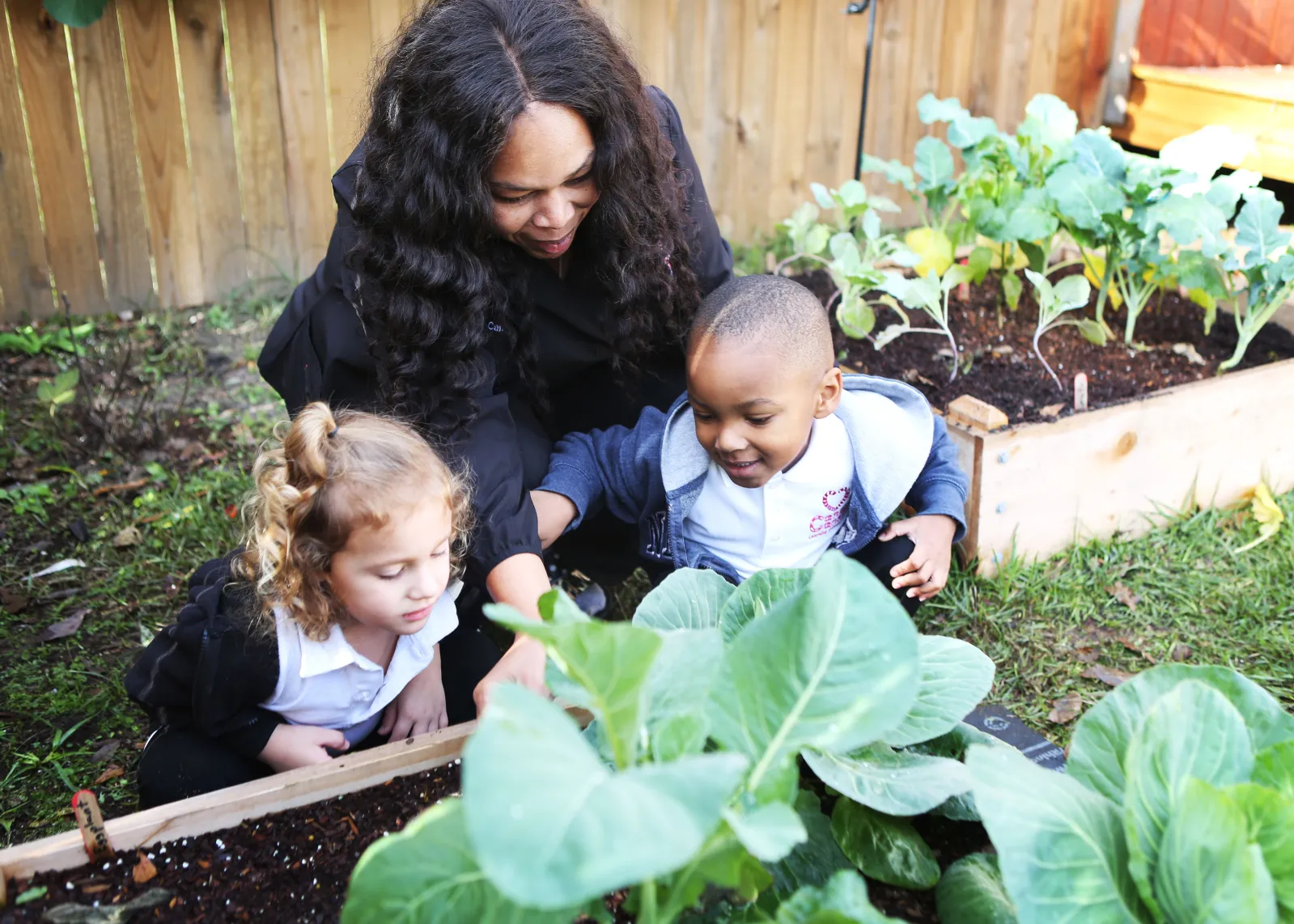 woman with kids in the garden