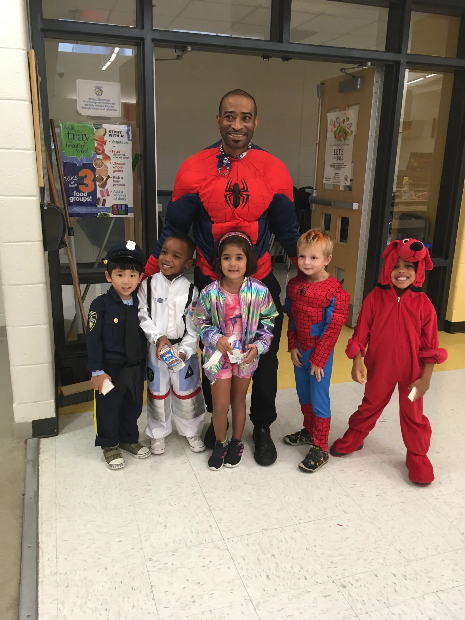Chef reggie dressed a spiderman with little kids