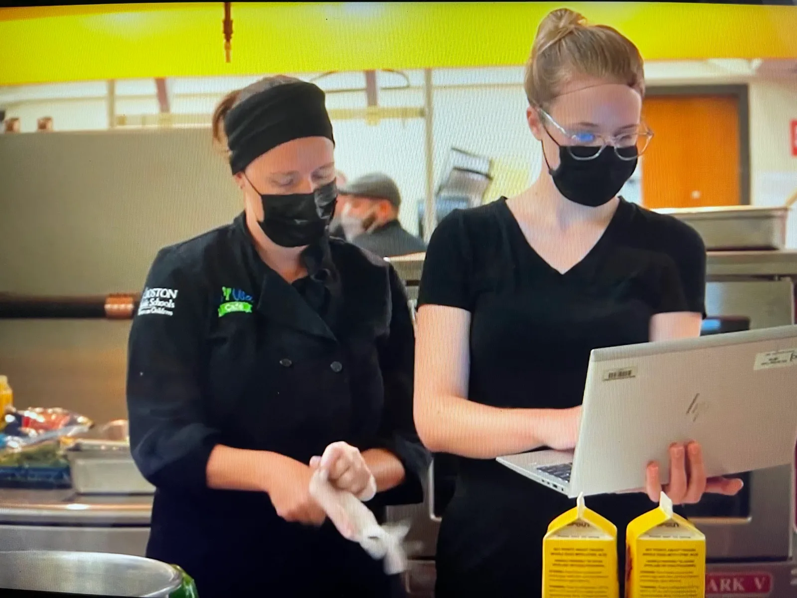 Chefs looking at computer