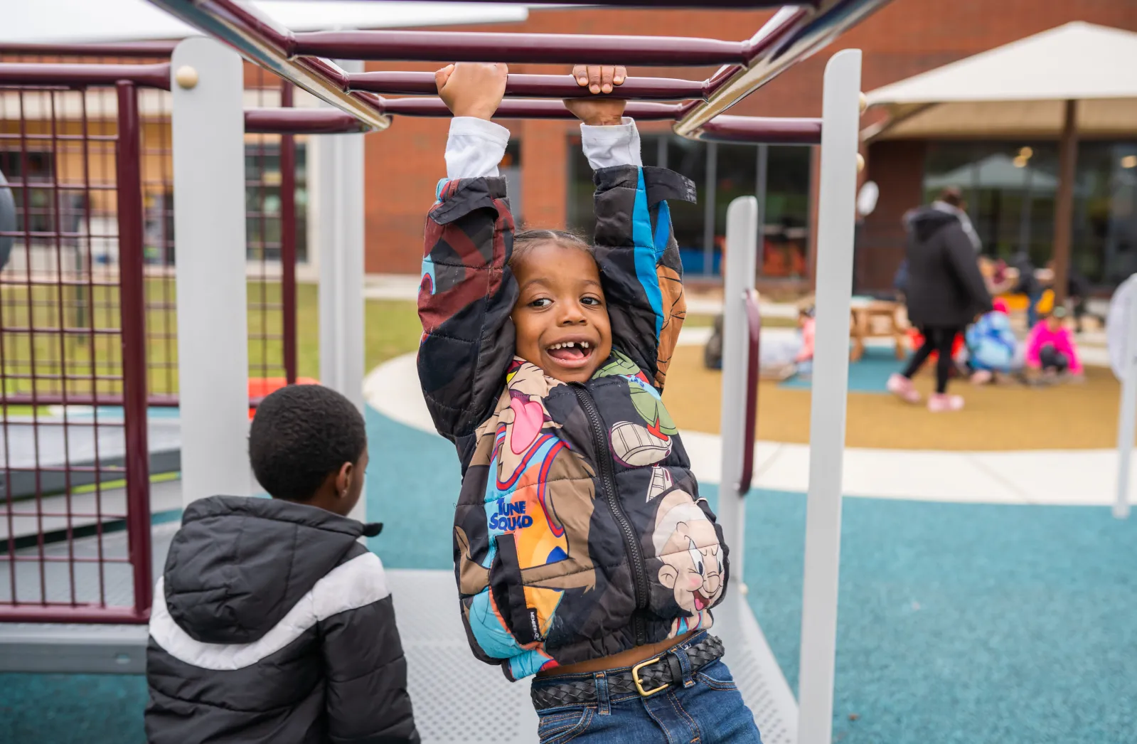 boy playing in monkey bars