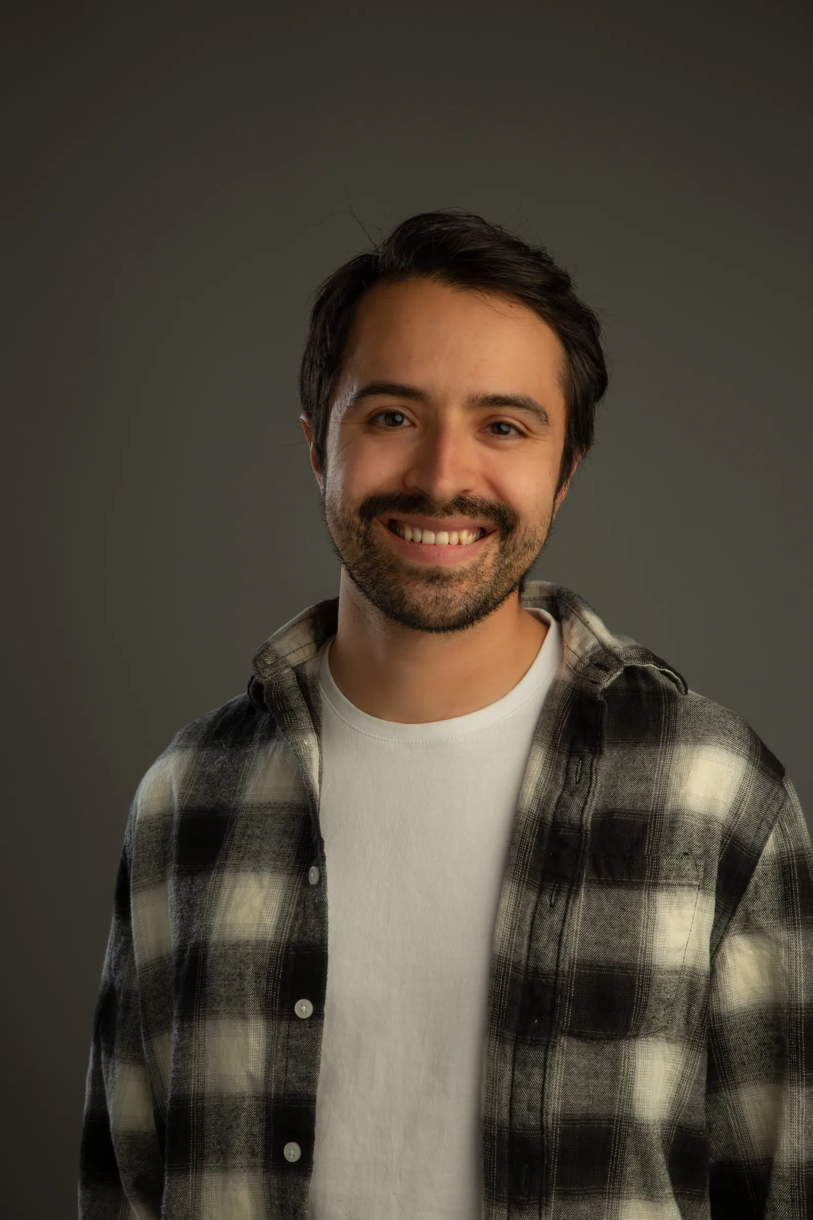 Headshot of Latino man with beard