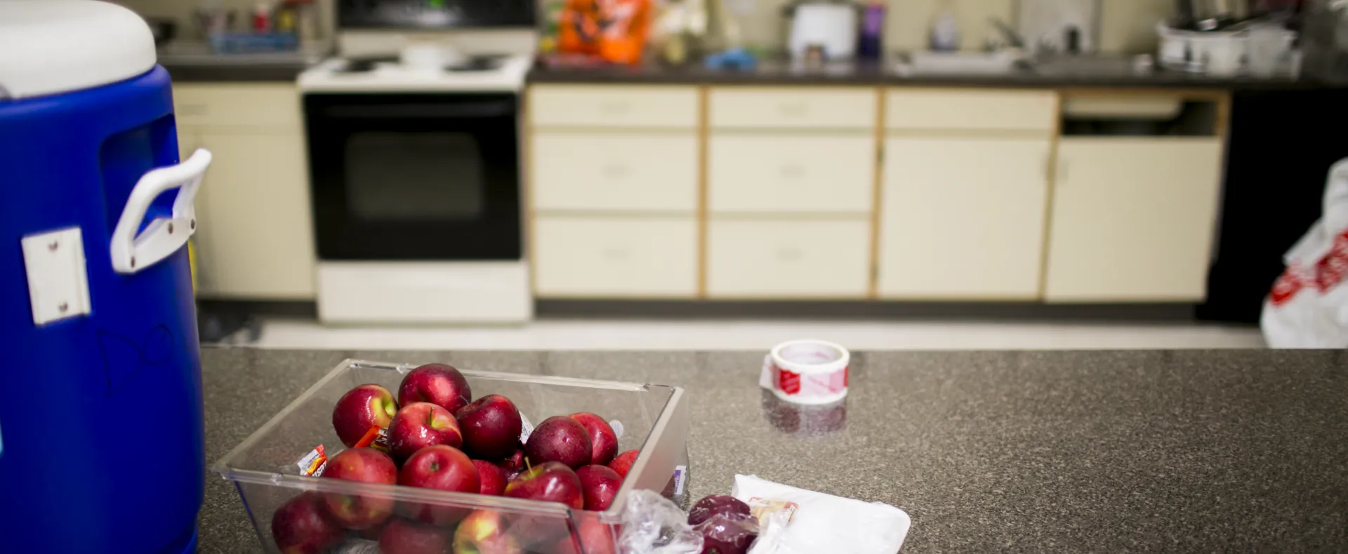 Basket of apples on a kitchen countertop