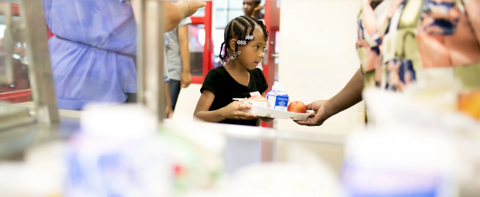 Girl getting lunch in cafeteria