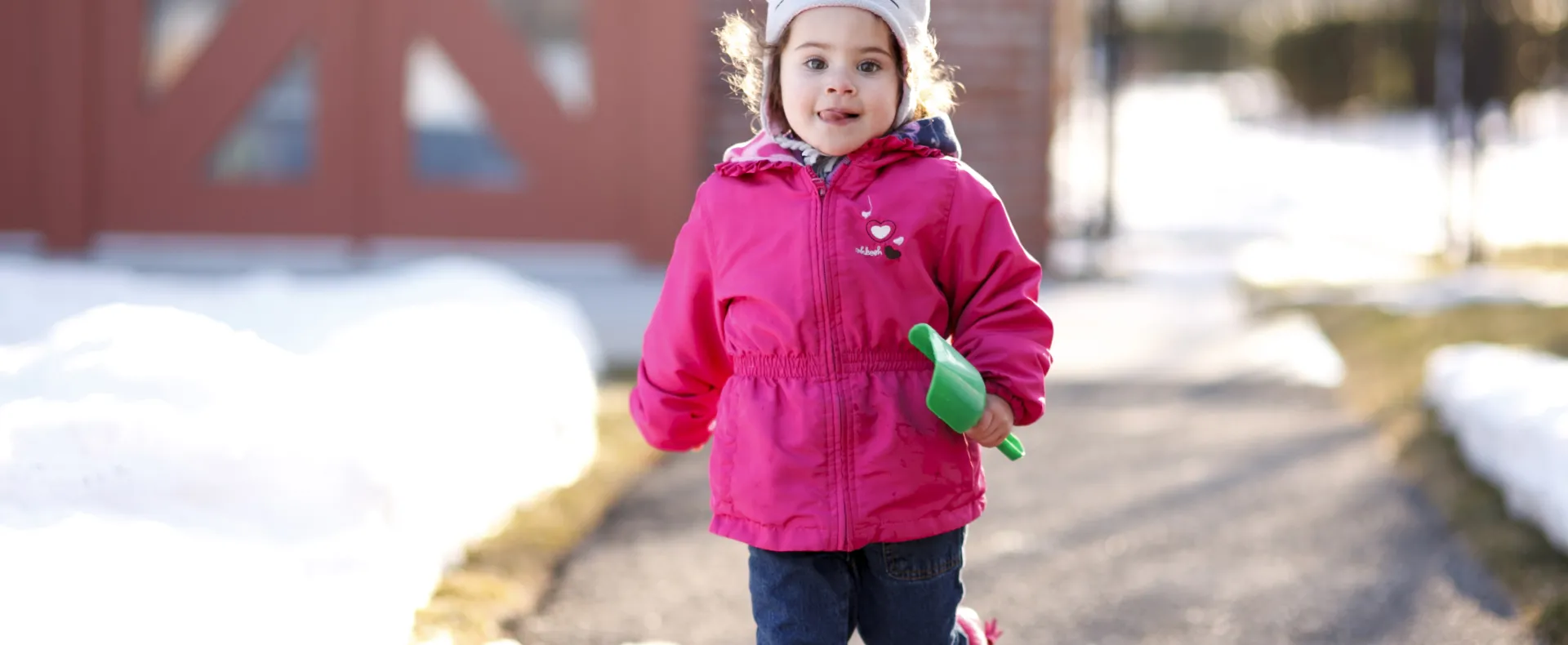 Girl running outside on a snowy day