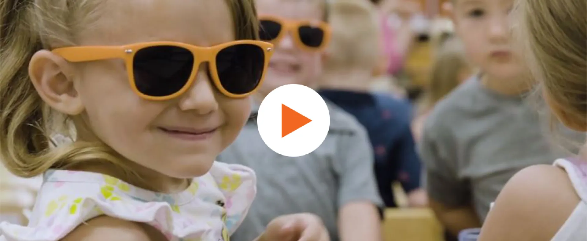 girl smiling in sunglasses