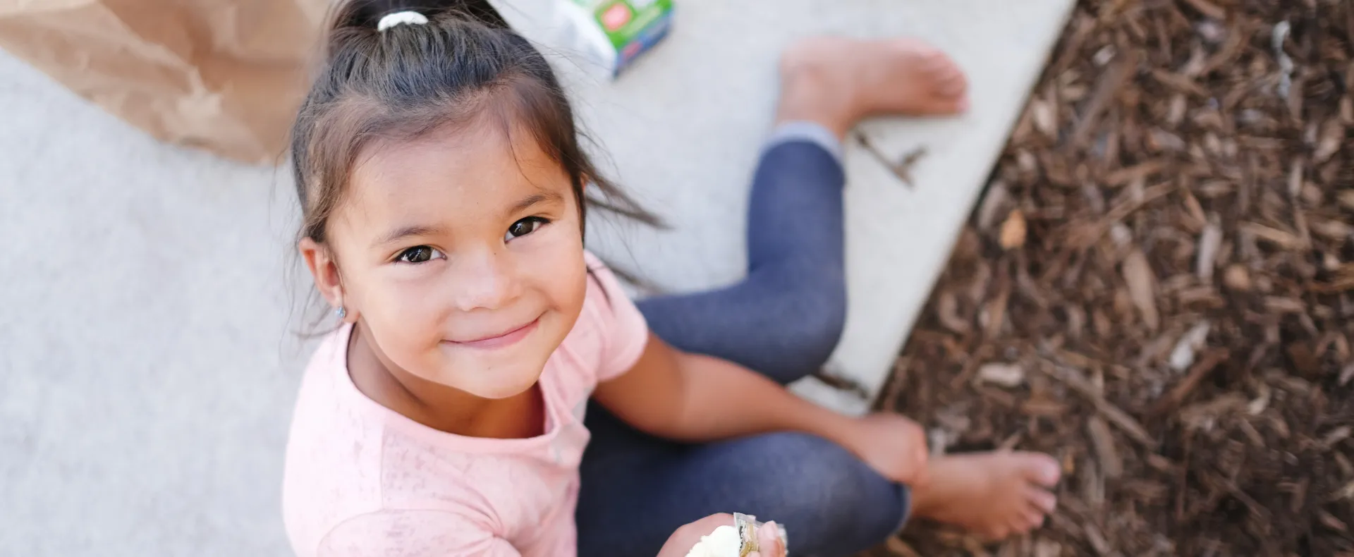 Little girl eating snack