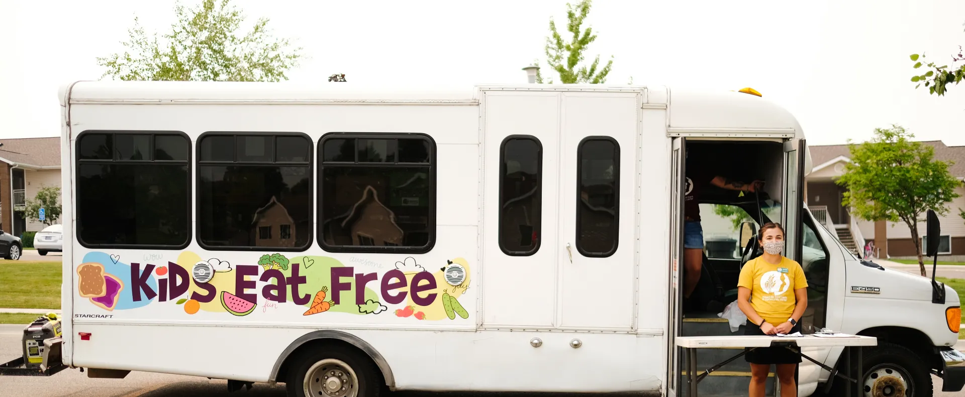 White truck with text kids eat for free