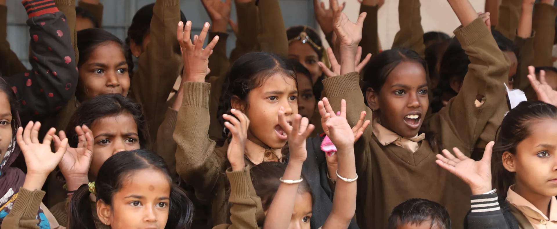 kids in India raising hands
