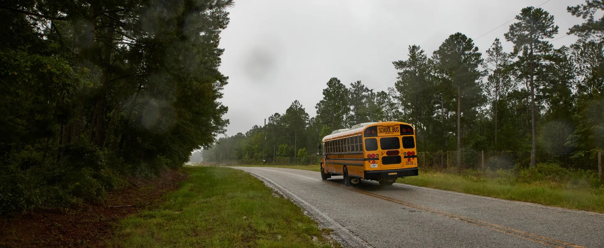 Hero image - school bus driving through rural area