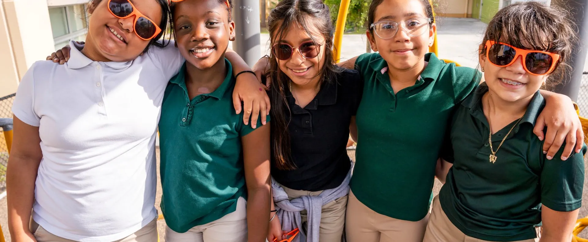Group of happy children in school uniforms
