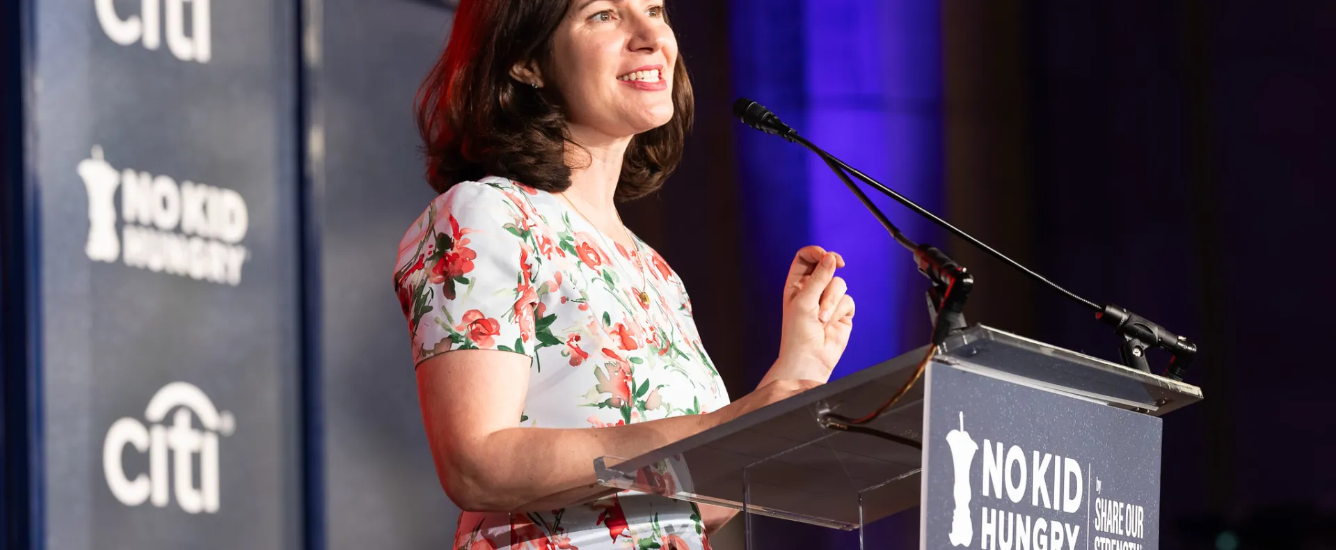 Anne Filipic speaking at podium