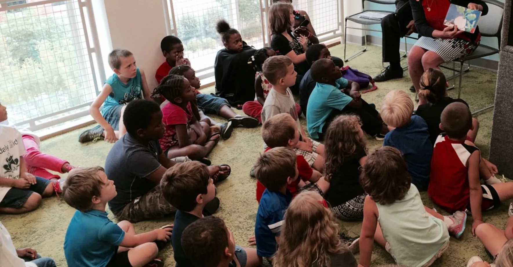 Teacher presenting to kids