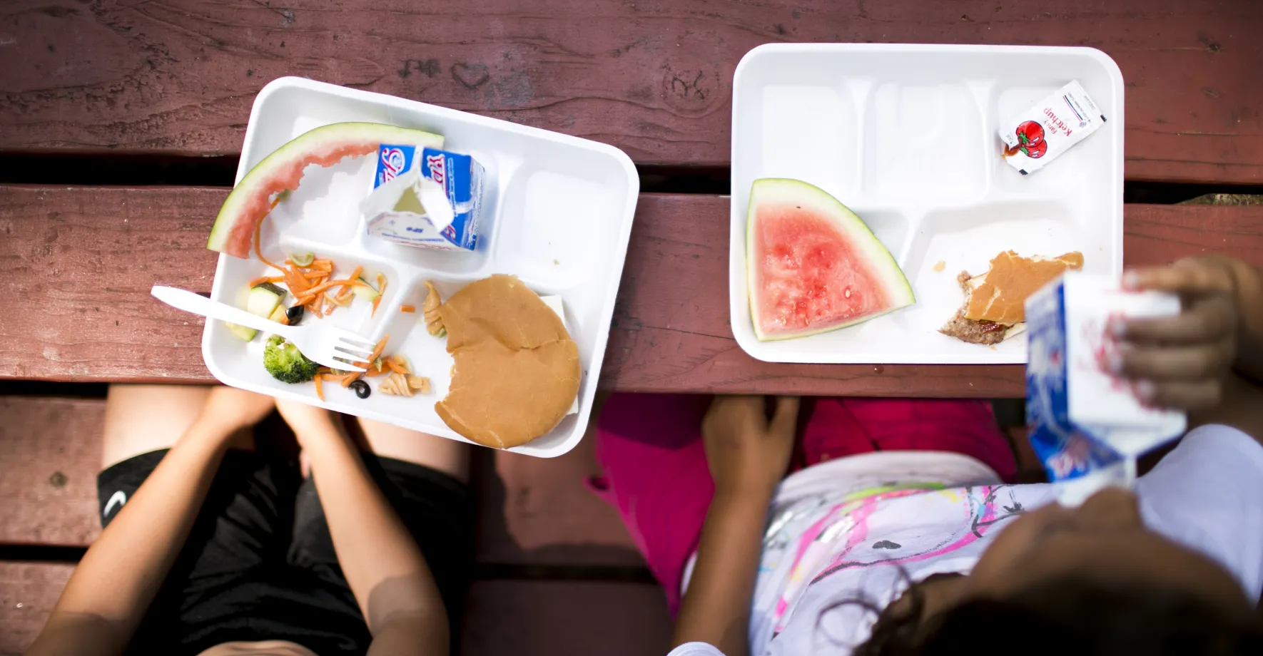 Kids eating free summer meals in their neighborhood