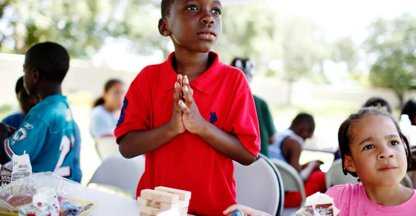 A little boy at a free summer meals site