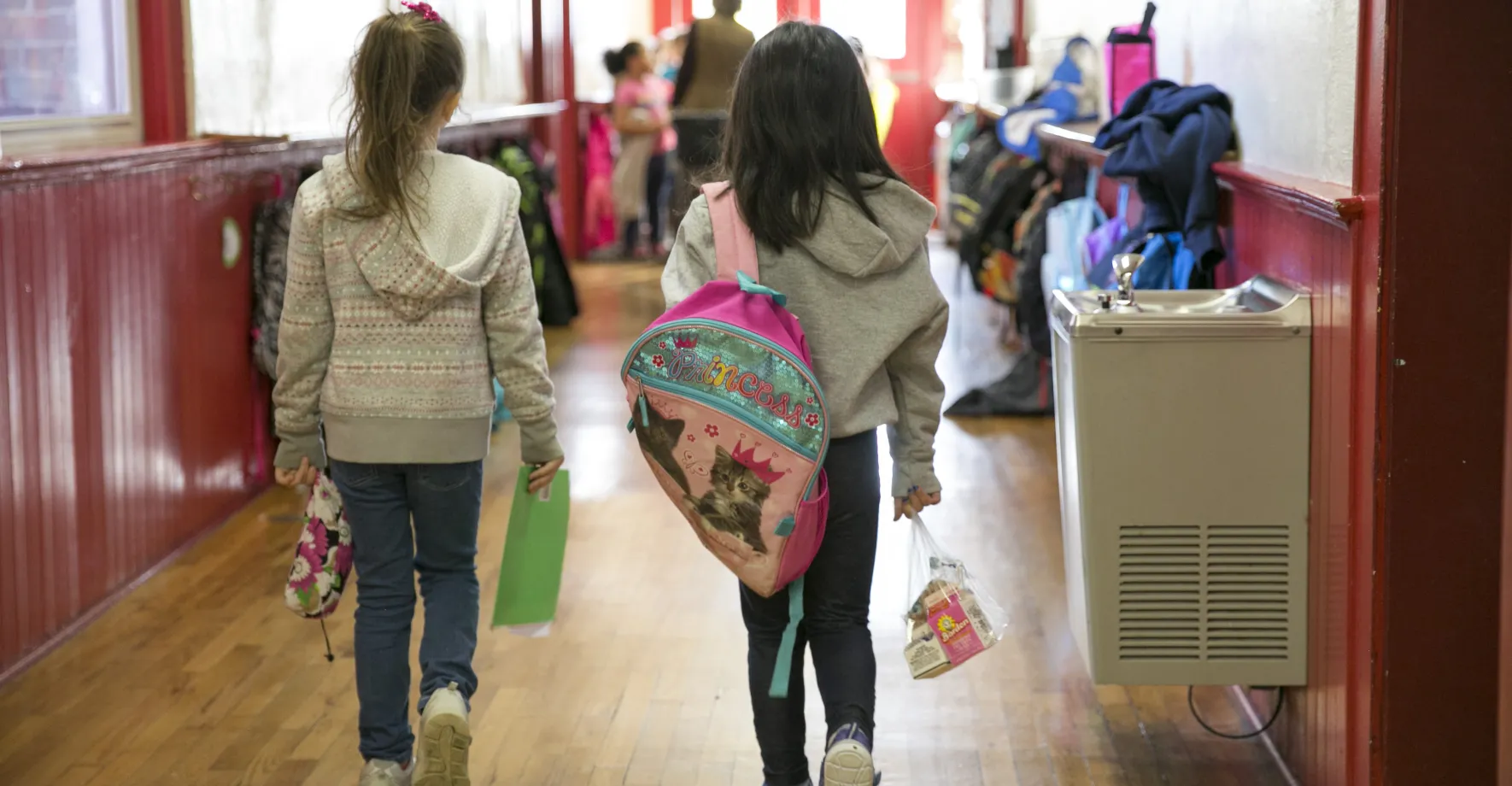 Kids walking in school hallway during COVID crisis