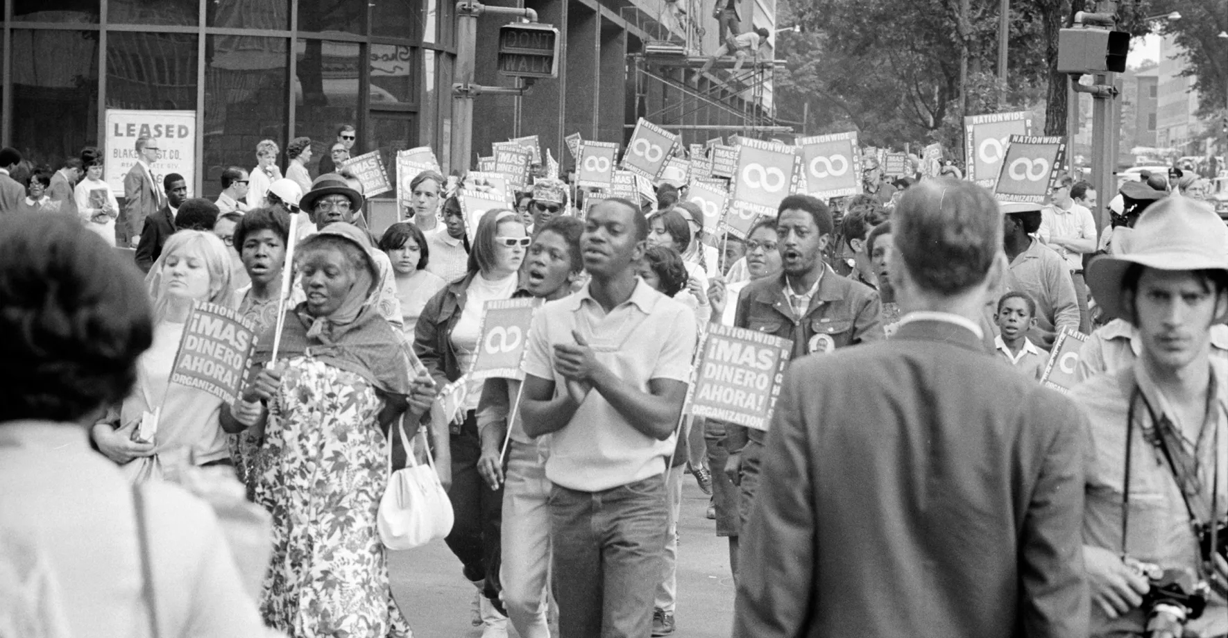 Black and white pic of people marching