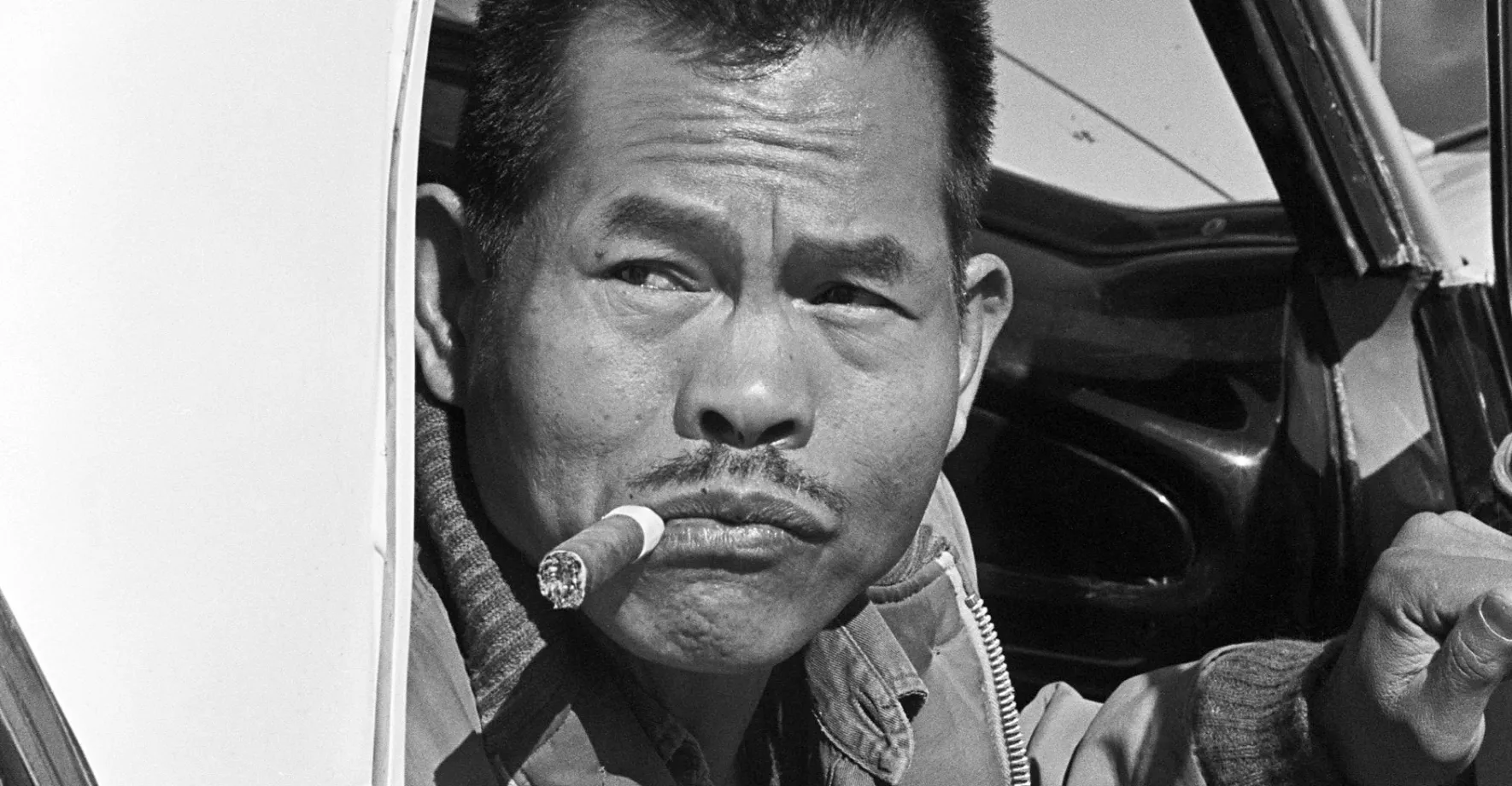 Black and white picture of Filipino man smoking