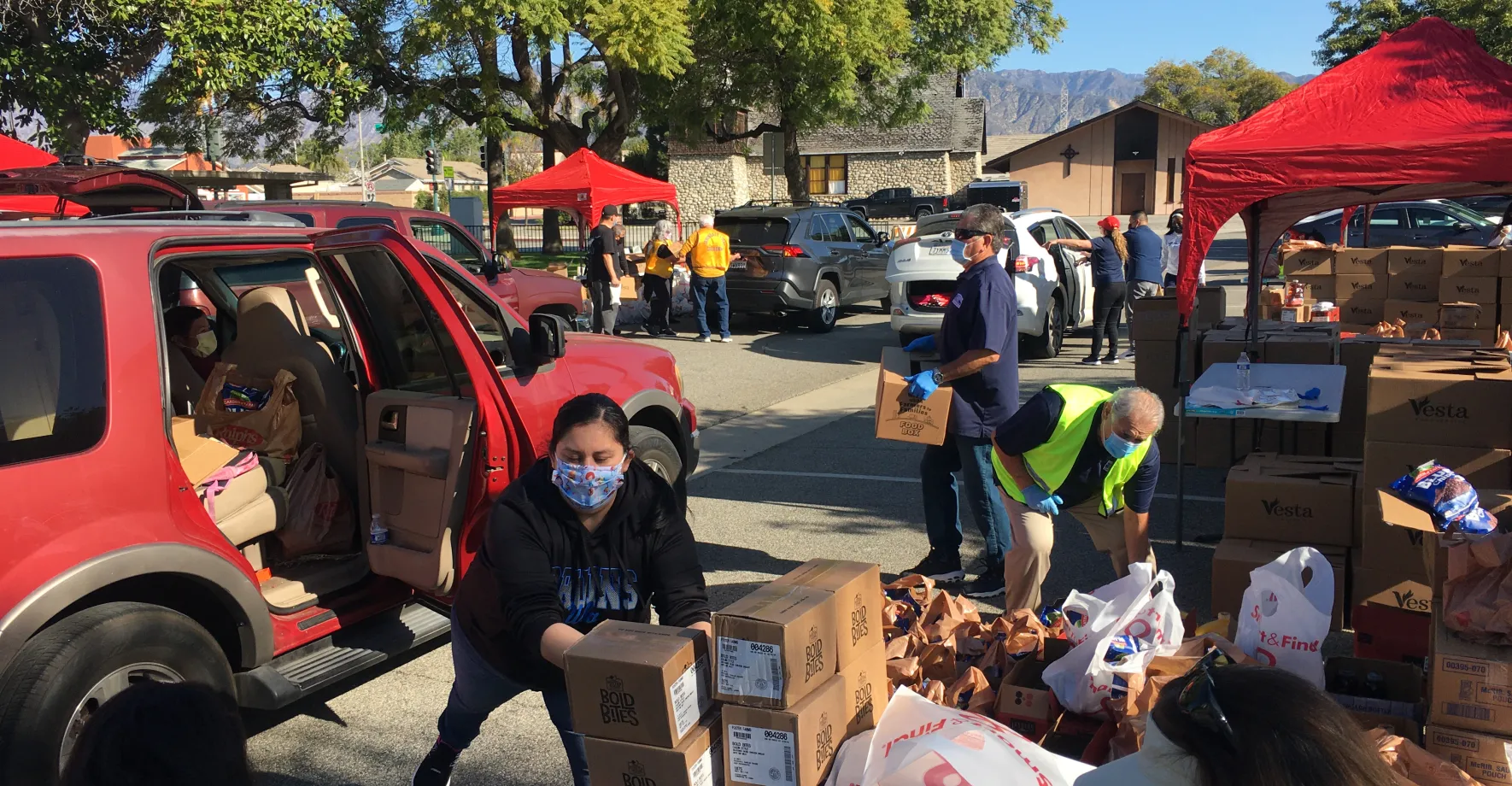 People wearing masks and delivering meals