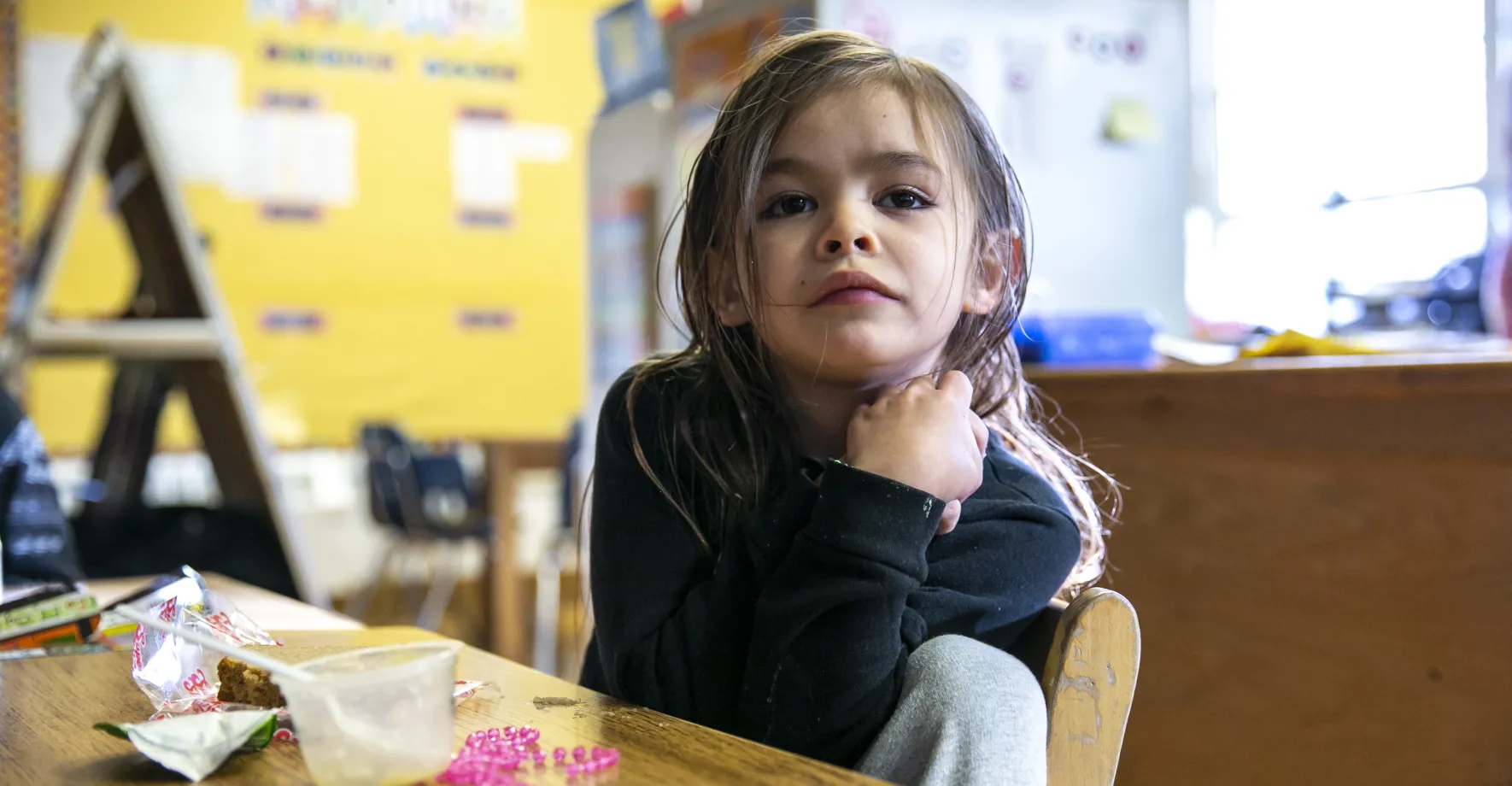 Child eating school meal in the classroom