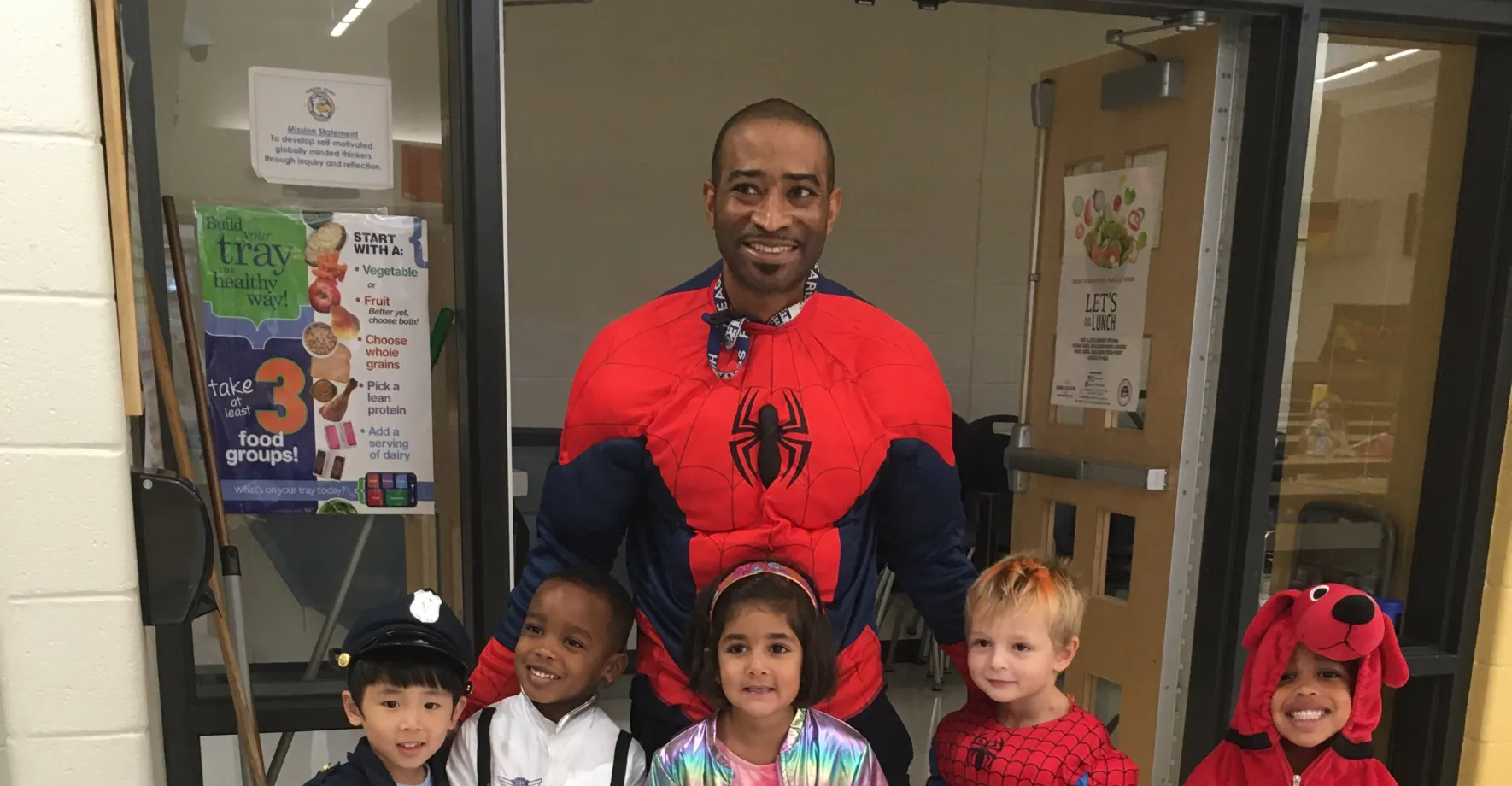 Chef reggie dressed a spiderman with little kids