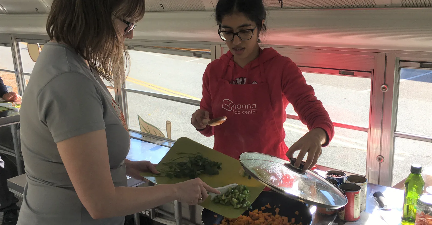 Women serving food in bus