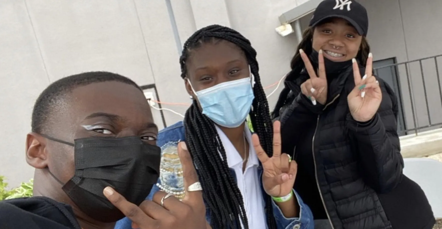 Youth Network Three Black teenagers posing for photo