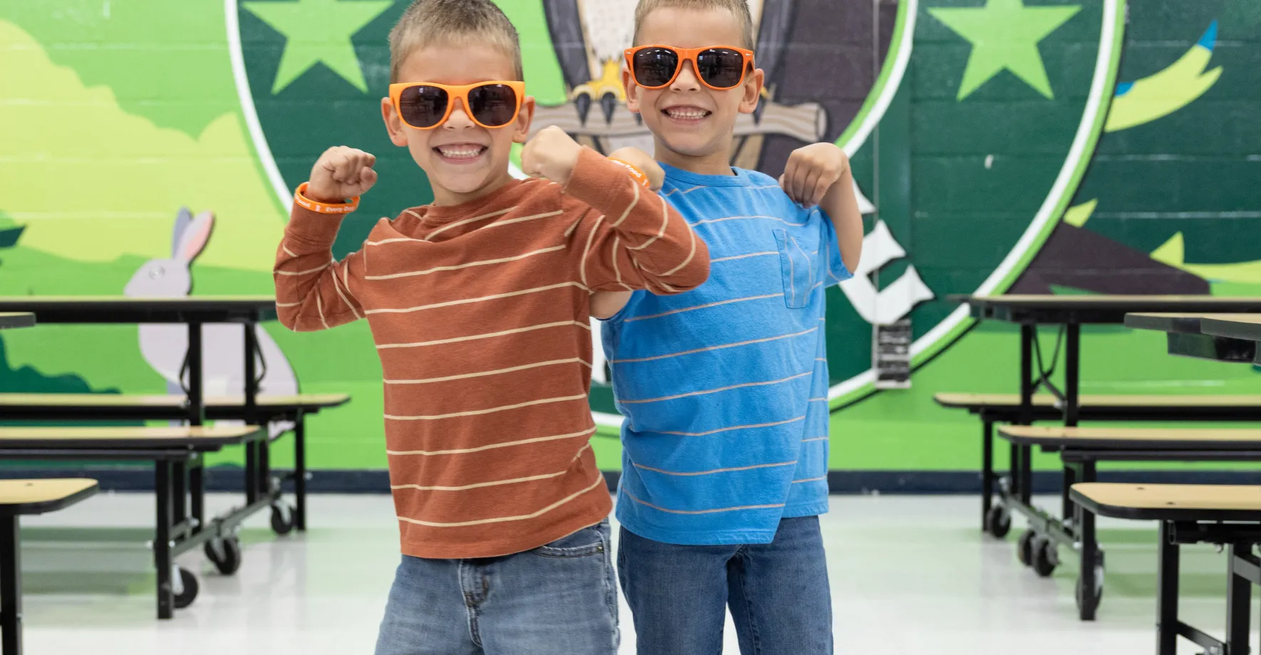 Twins with sunglasses in a school