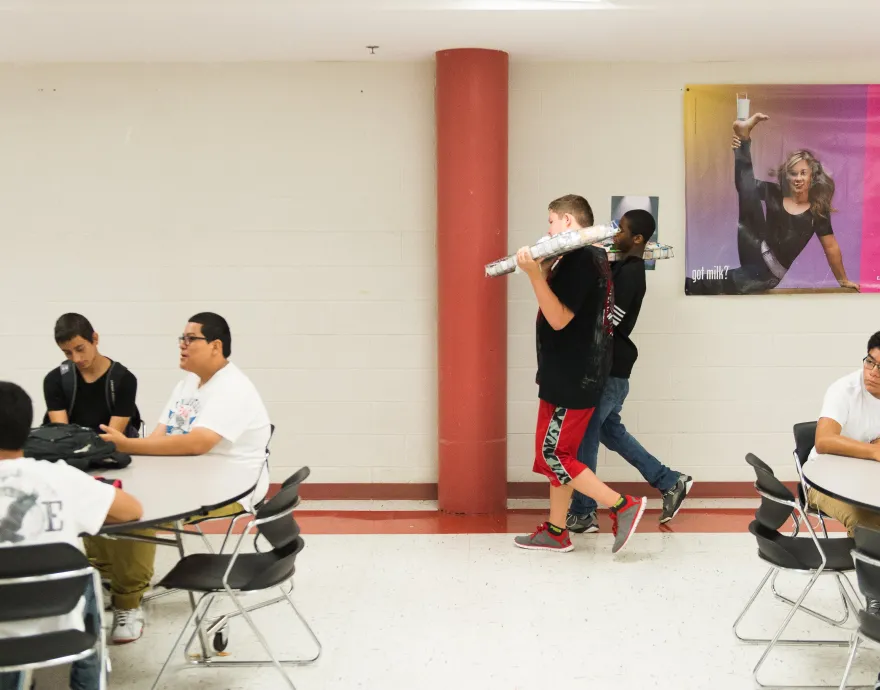 A student walks through the cafeteria