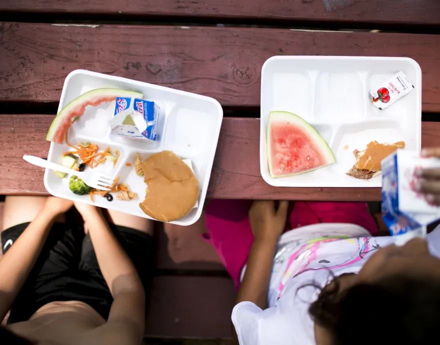 Kids eating free summer meals in their neighborhood