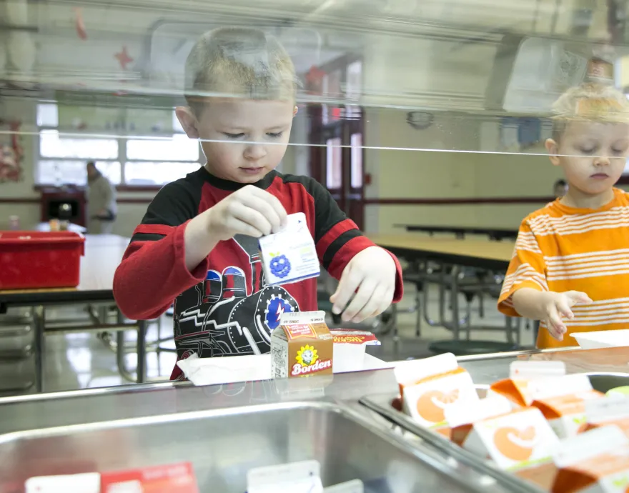 boys getting breakfast in the cafeteria