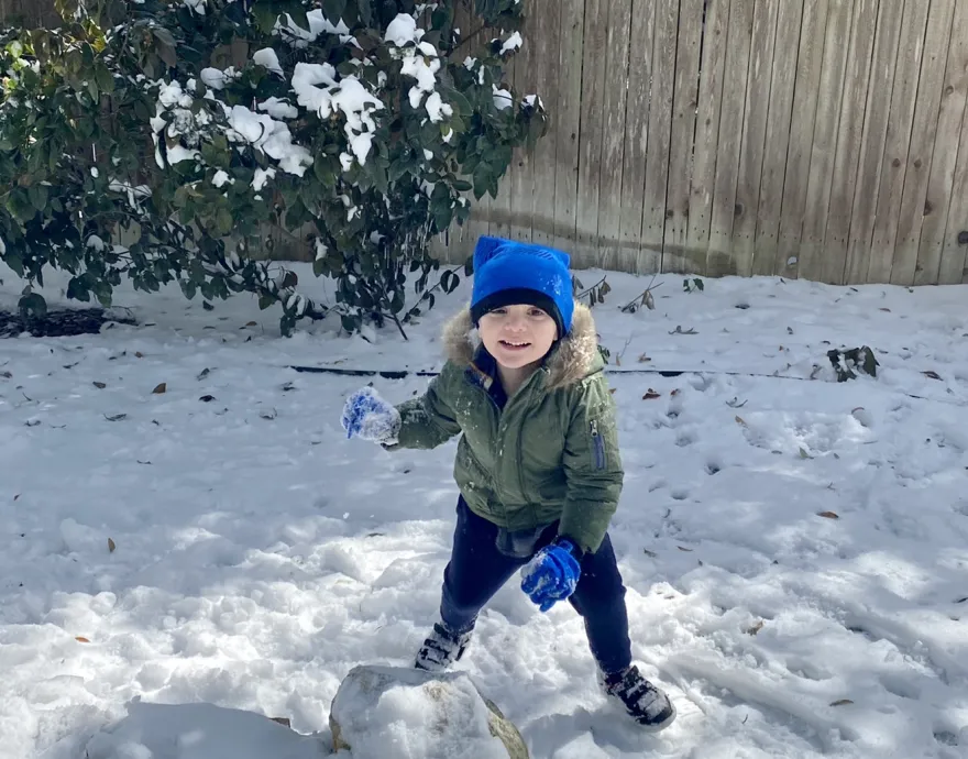 Stacie's son playing in the snow