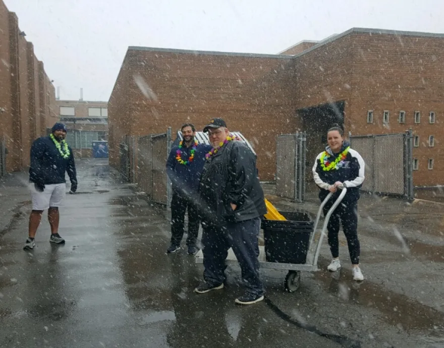 People serving food in the snow