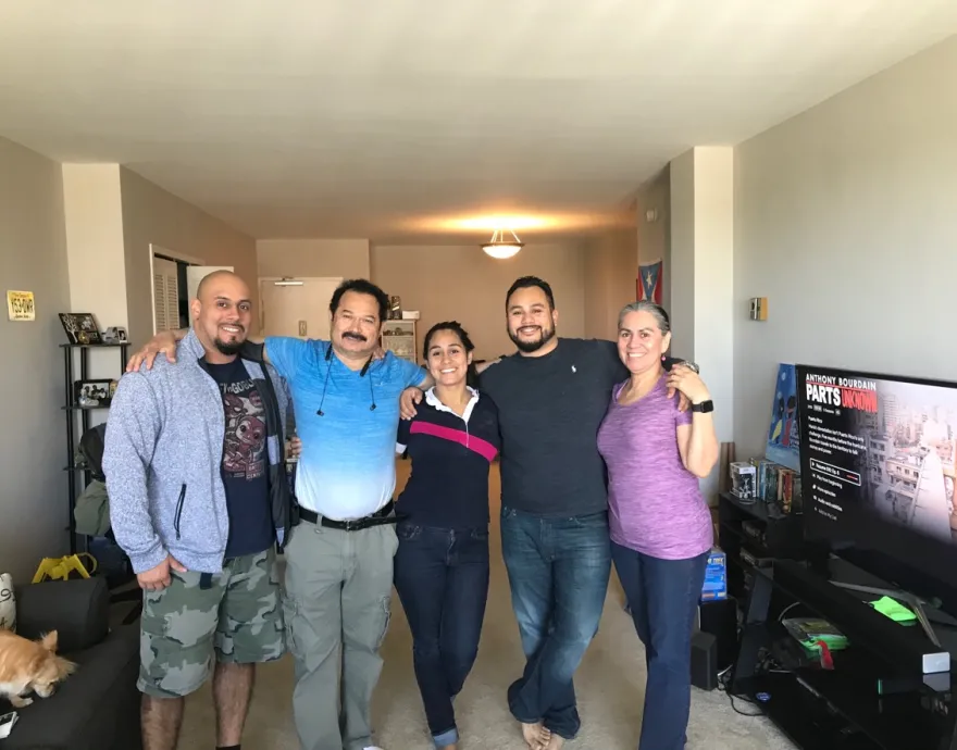 Family in living room. a mom a dad and three kids