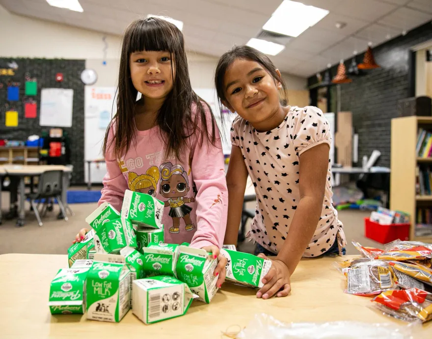 Kids in classroom with milk cartons