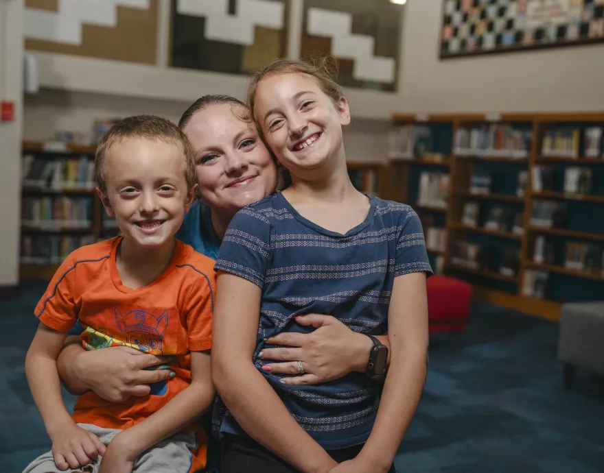 Mom with children at library