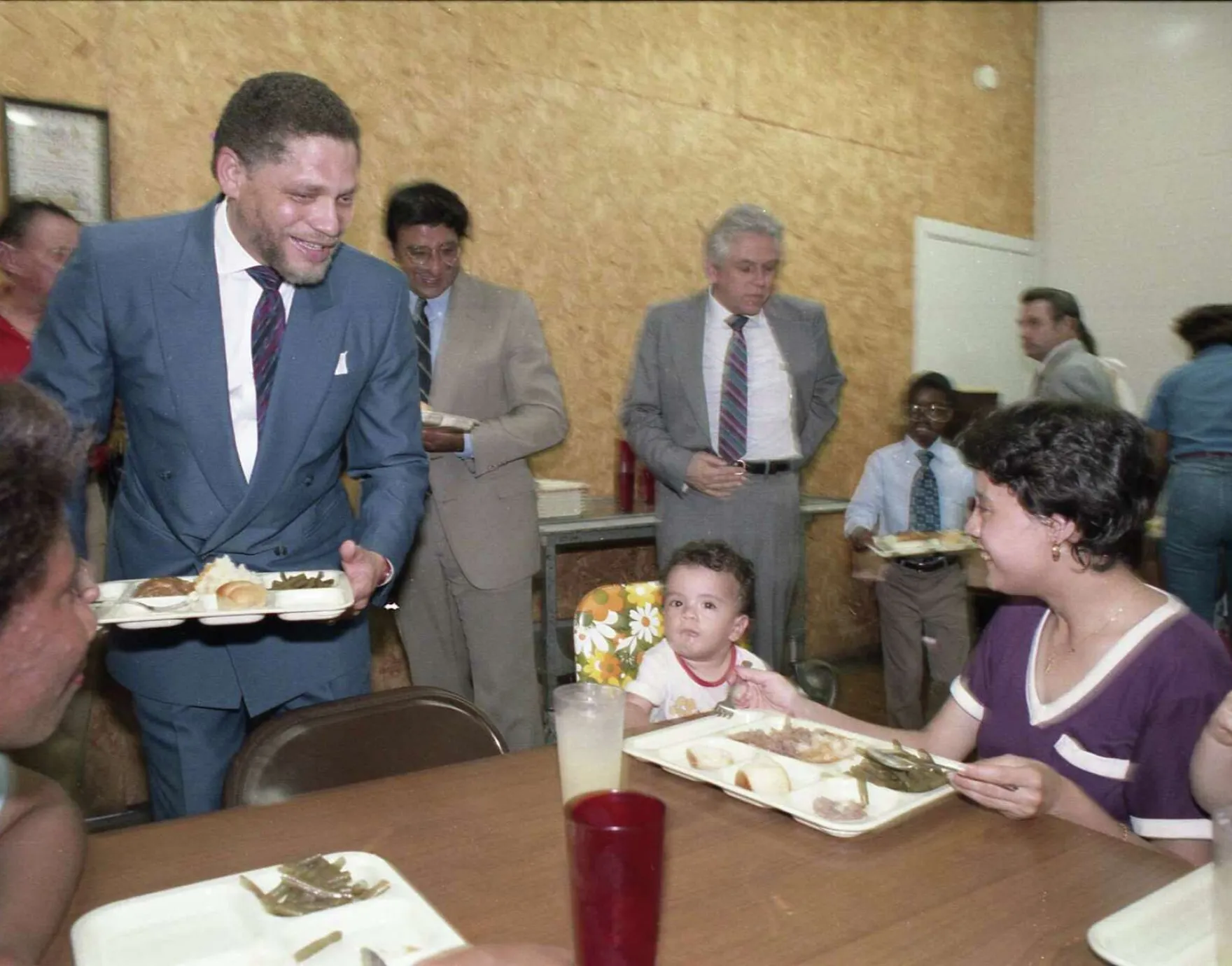 Rep. George “Mickey” Leland carrying lunch tray
