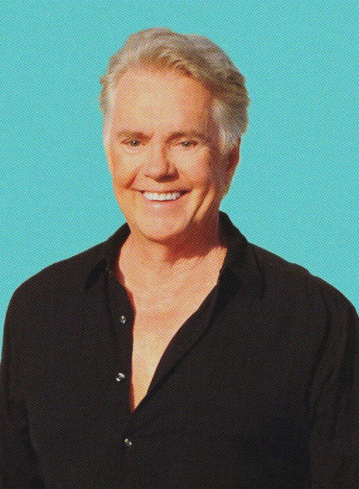 Shaun Cassidy headshot on blue background