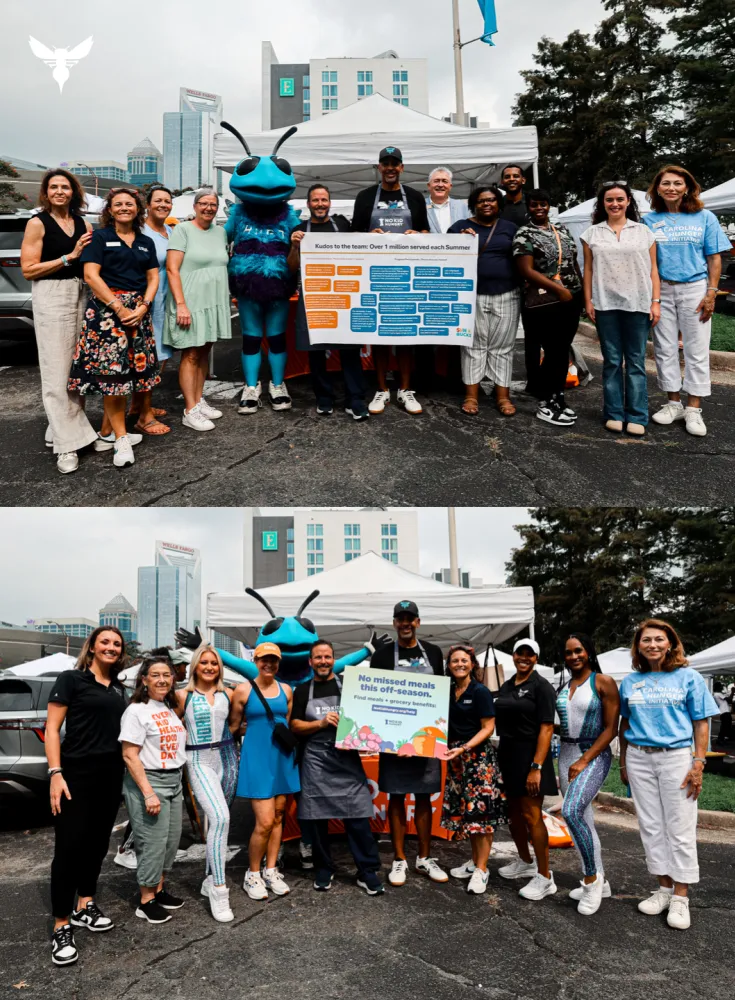 Crew at Charlotte's Uptown Farmers Market holding up banners