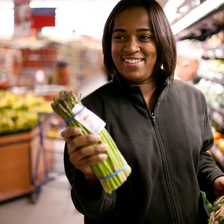 Woman Holding Asparagus