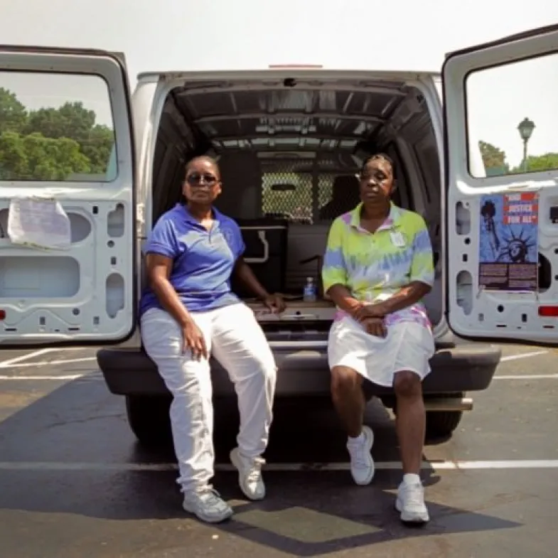 Helpers sitting in van