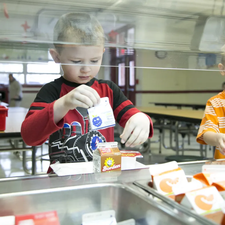 boys getting breakfast in the cafeteria