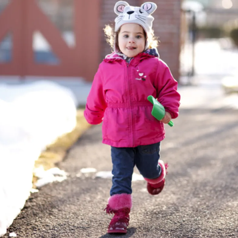 Girl running in the snow