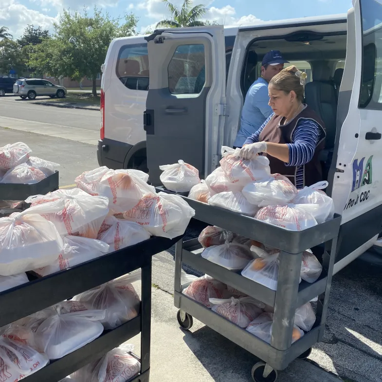 Volunteers deliver food to hungry kids during coronavirus-related school closures.