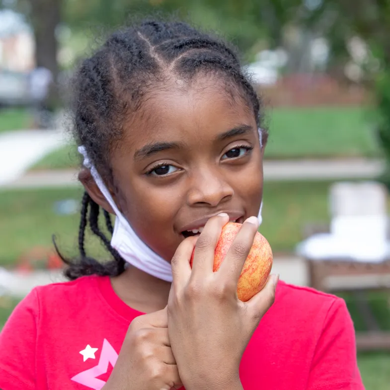 Girl eating fruit during Coronavirus shutdowns